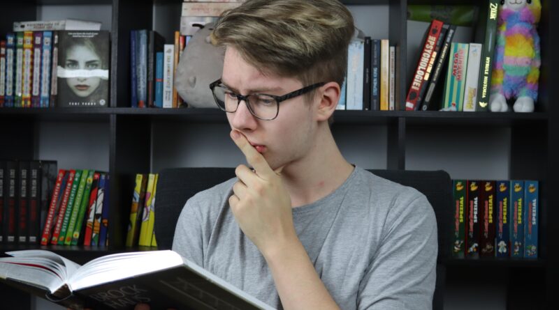 re-reading vs retrieval practice - student thinking while studying with book