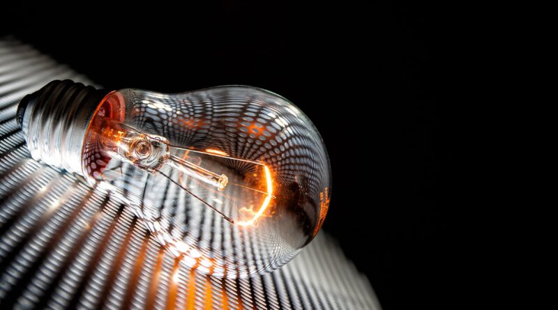 invent the lightbulb - vintage glowing filament bulb