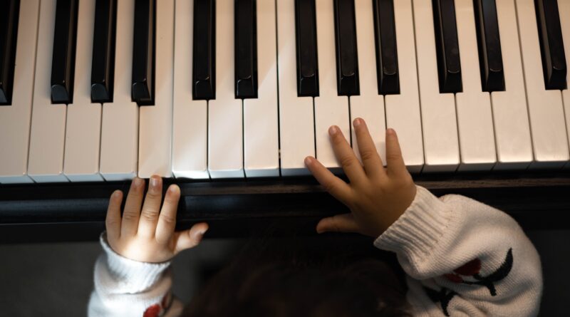 mozart child prodigy - young child hands on piano keys